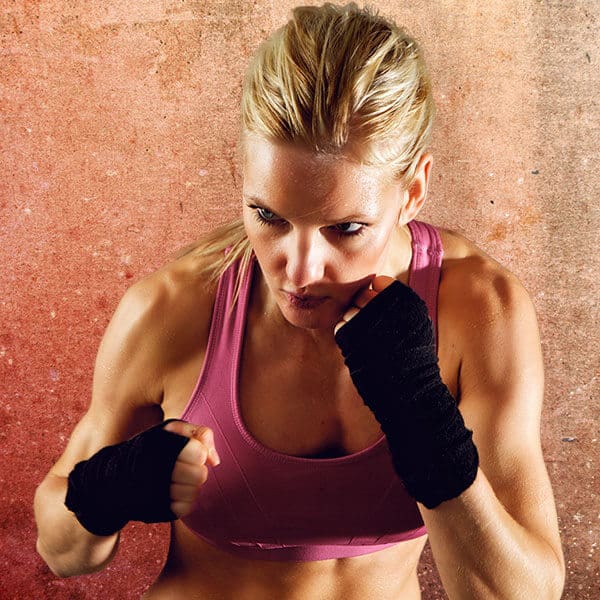 Mixed Martial Arts Lessons for Adults in Mundelein IL - Lady Kickboxing Focused Background