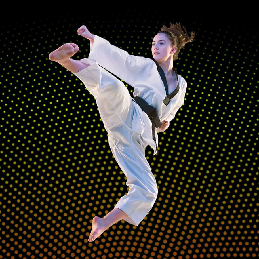 Martial Arts Lessons for Adults in Mundelein IL - Girl Black Belt Jumping High Kick